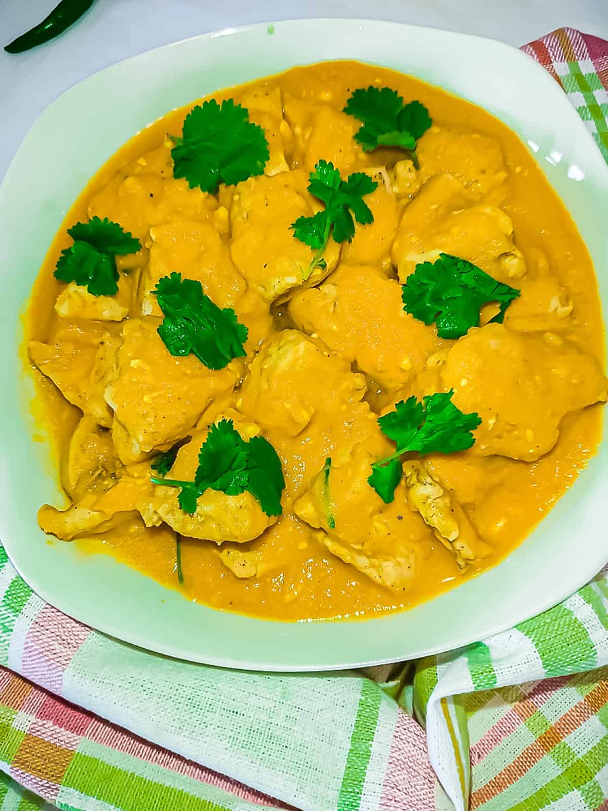 Dijon mustard chicken in a white plate.