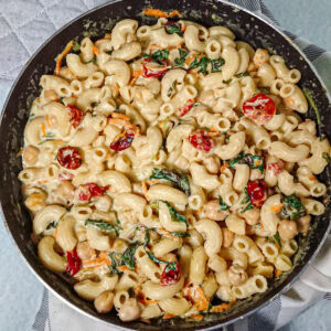 Creamy vegetable pasta in a pan.