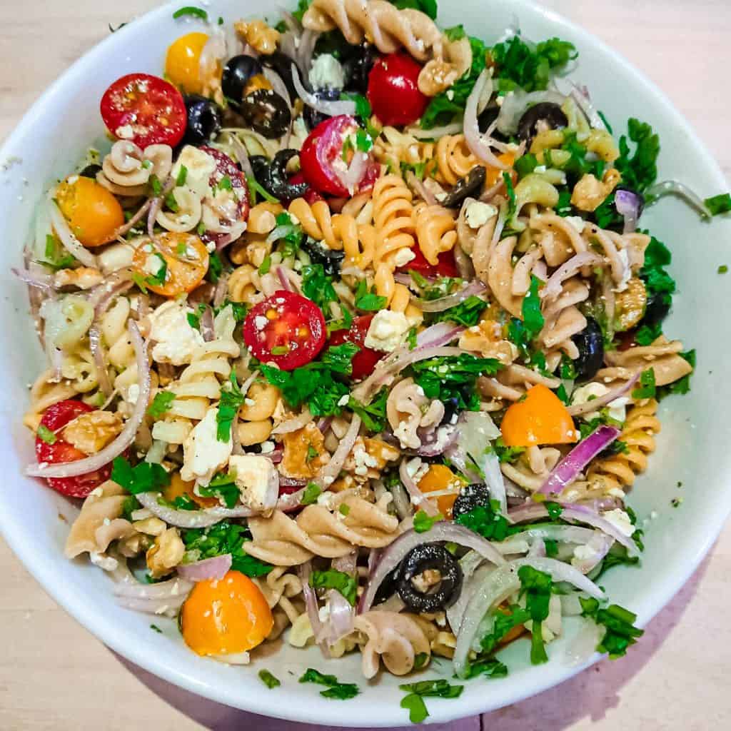 easy Italian pasta salad with balsamic dressing in a ceramic bowl.
