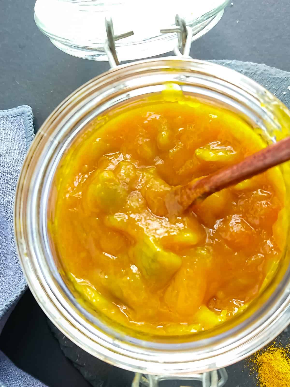 Easy green mango chutney (5-ingredient recipe) closeup view of homemade green mango chutney in a glass jar.