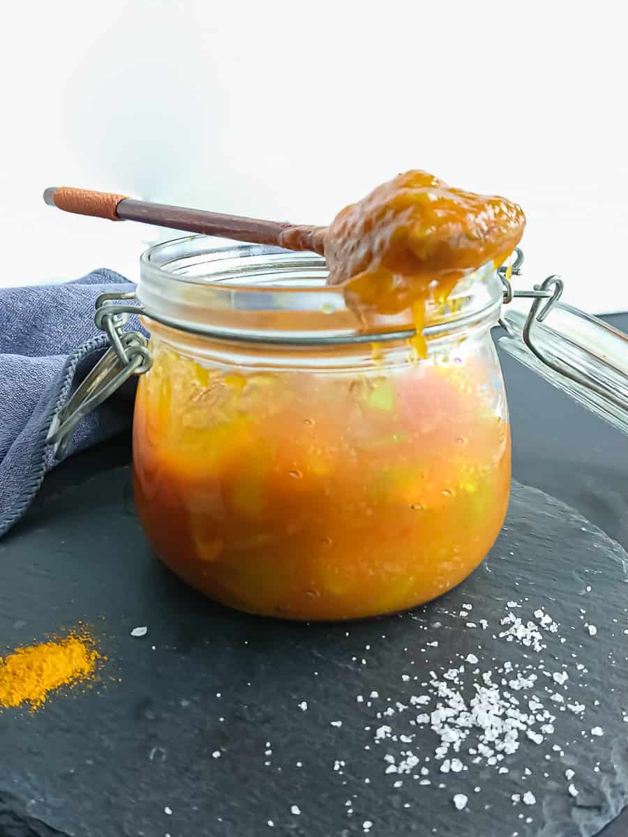 homemade raw mango chutney in a glass jar.