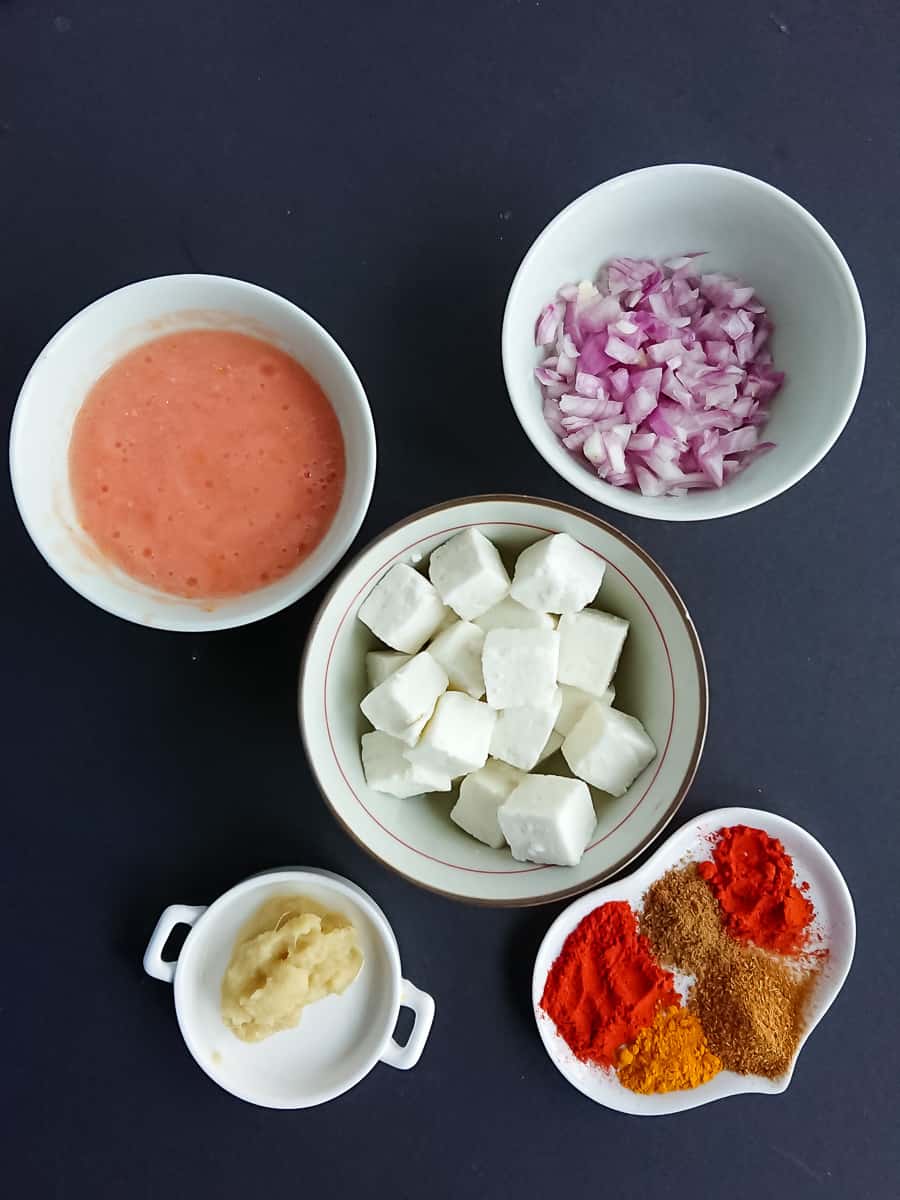 paneer cubes, onions, tomato puree, ginger garlic paste and spices- ingredients for paneer filling for paneer kathi rolls