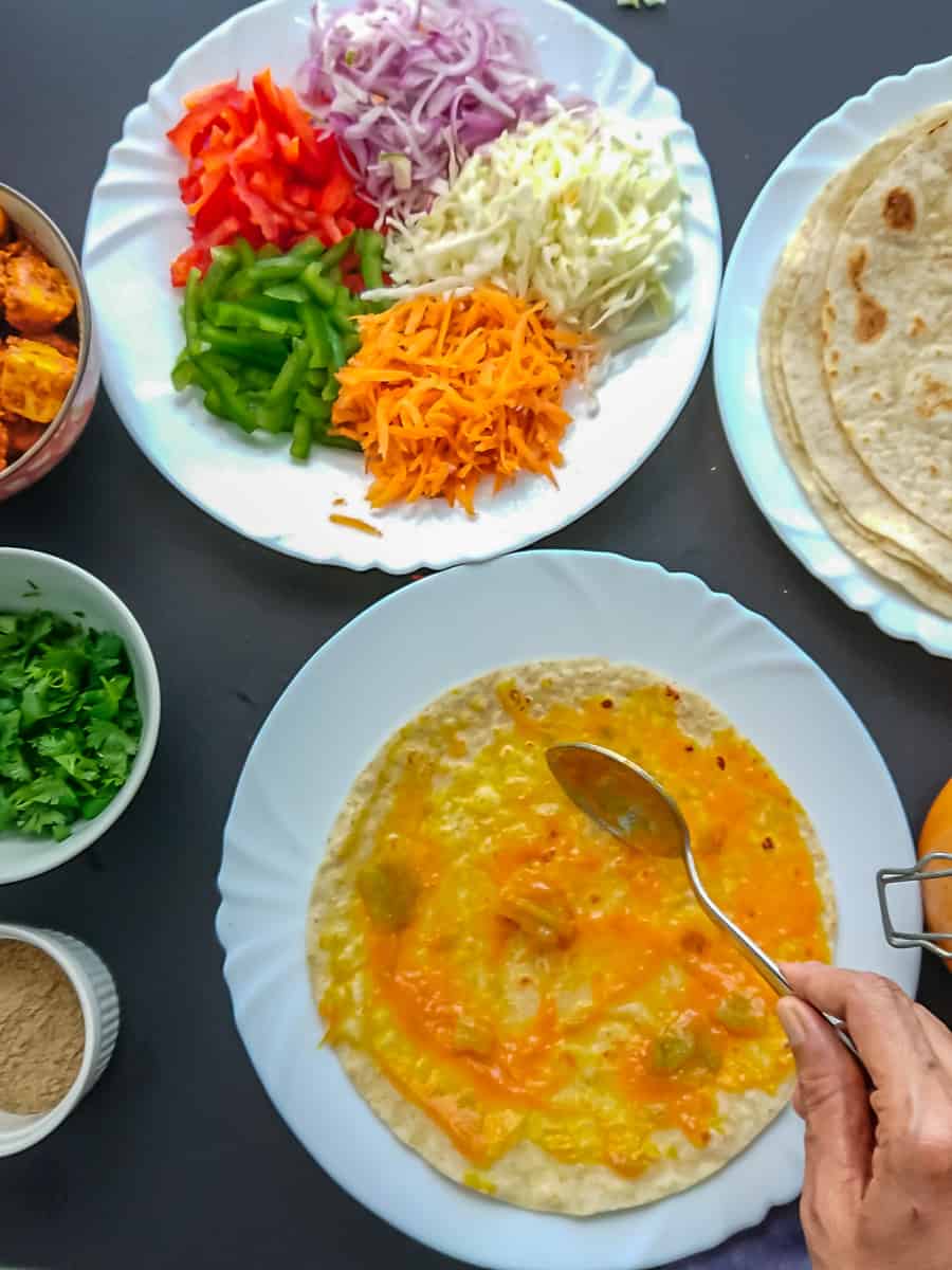 paneer roll ingredients- flour tortillas, mango chutney, veggies, chaat masala and coriander leaves