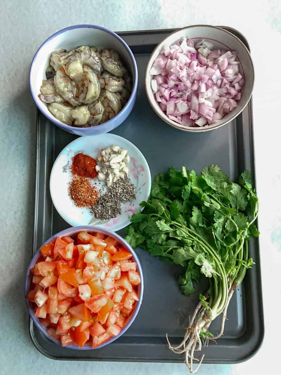 ingredients for angel hair pasta with shrimps in tomato sauce