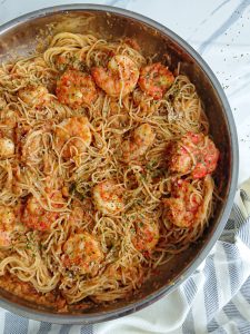 Chilli and Garlic Prawn Pasta in Spicy Tomato Sauce in a wide pan.