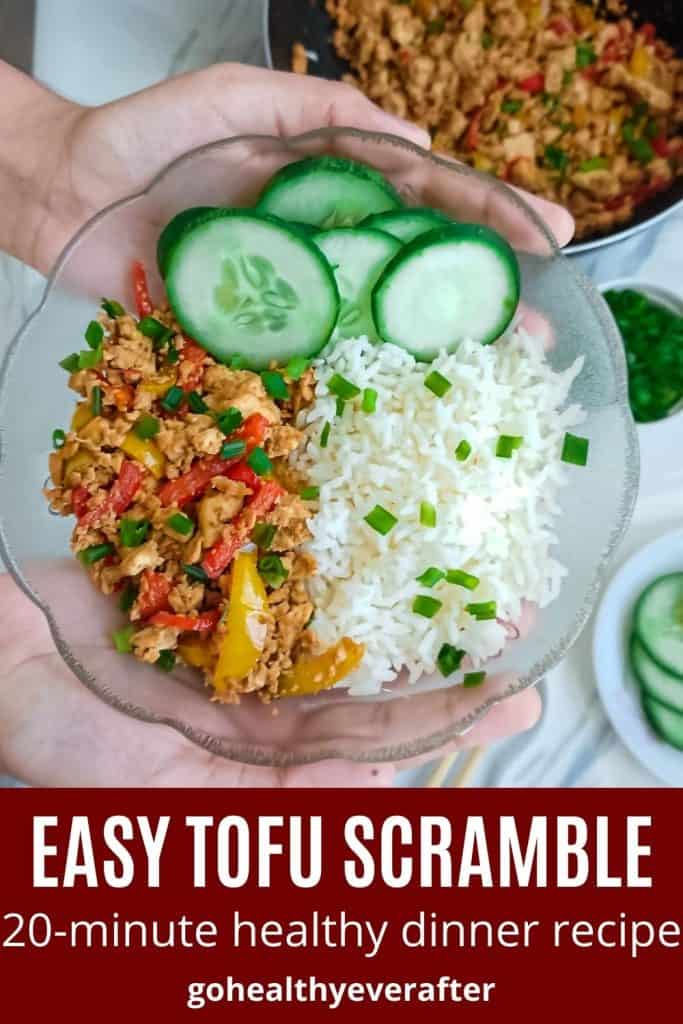 chili garlic tofu scramble served with rice and cucumber slices in a glass bowl
