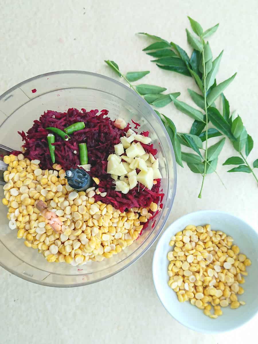 beets, soaked lentils and spices ready to be blended in a food processor