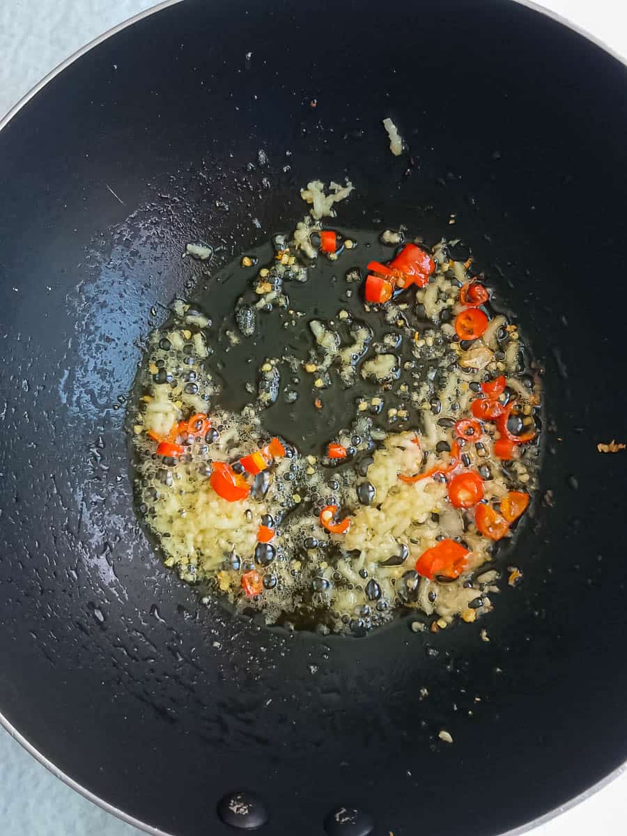 stir-frying garlic and chilies for spicy tofu scramble