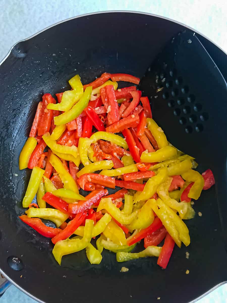 stir-frying bell peppers for spicy tofu scramble