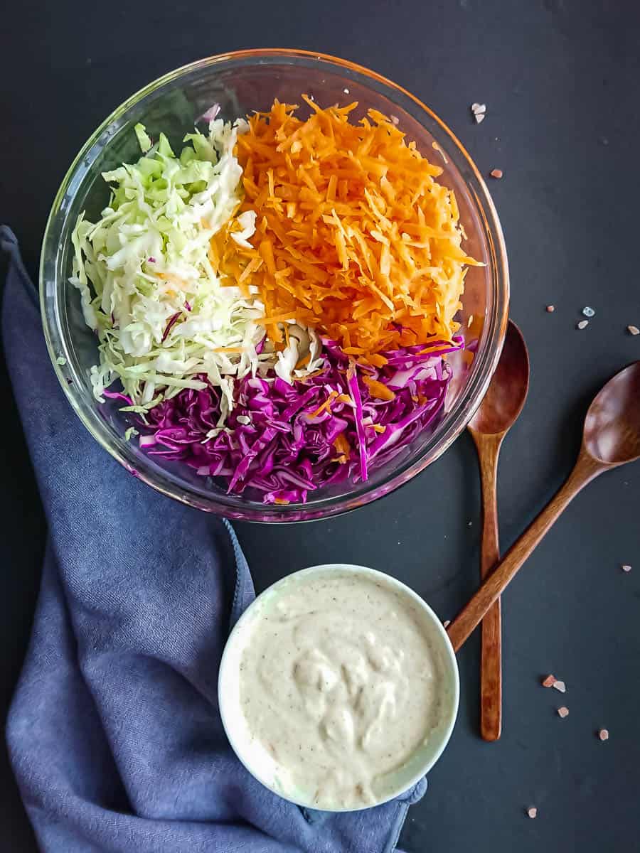 ingredients for honey mustard slaw recipe- cabbage, carrots and the no mayo dressing.