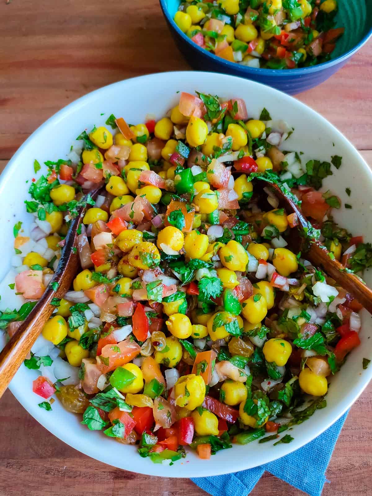 Simple chana salad in a white bowl.
