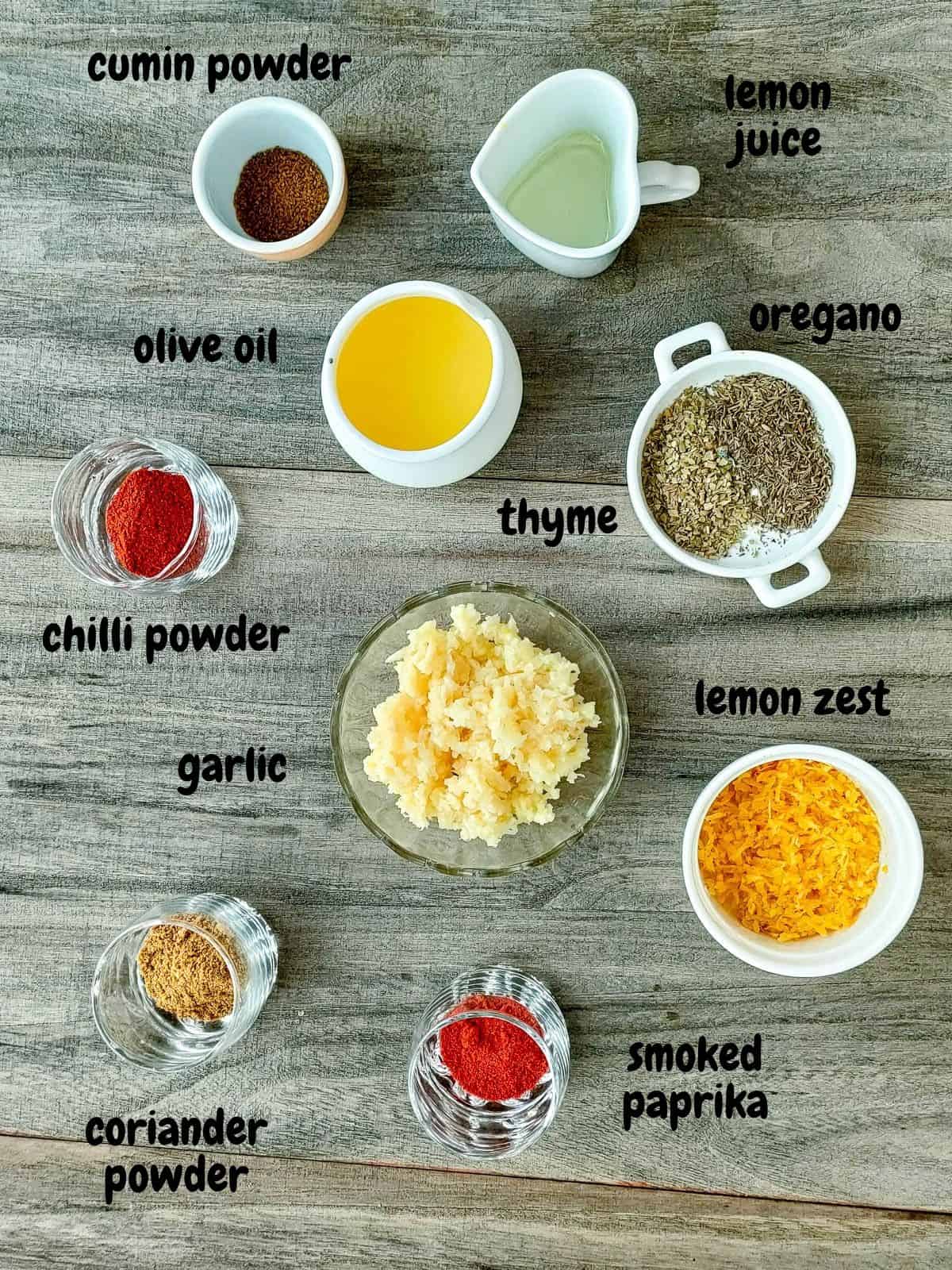 Labelled ingredients for herb and garlic seasoning.