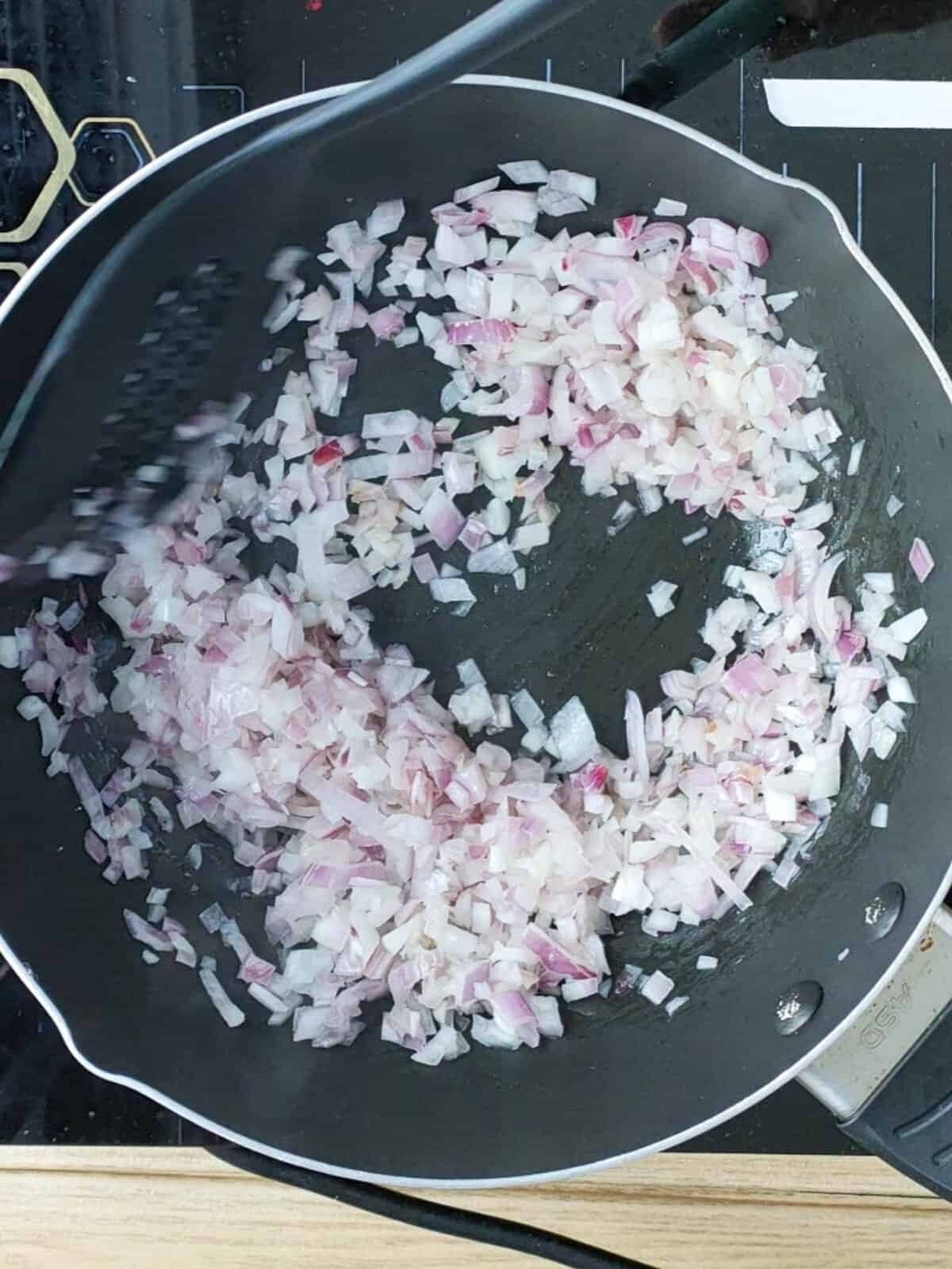 Onions being sauteed for fish cakes.