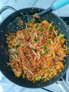Singapore fried bee hoon in a non-stick wok.