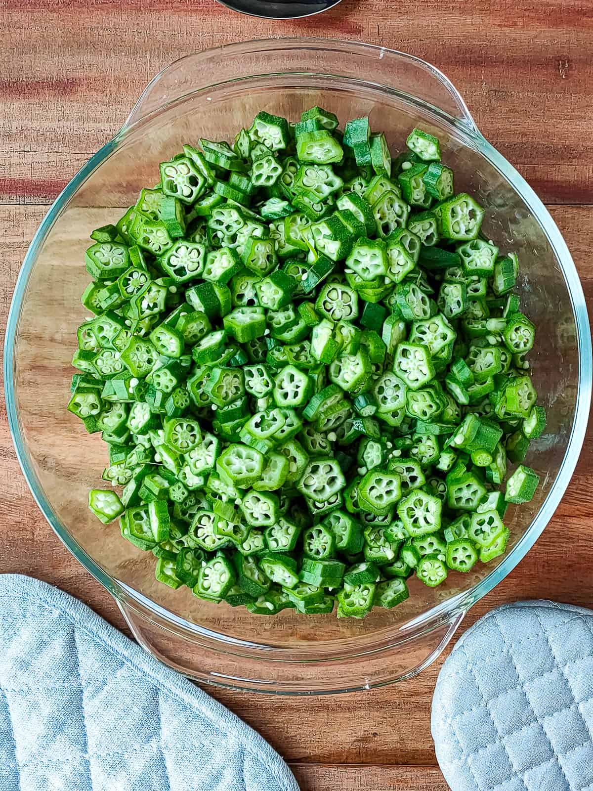 chopped okra in a glass bowl.