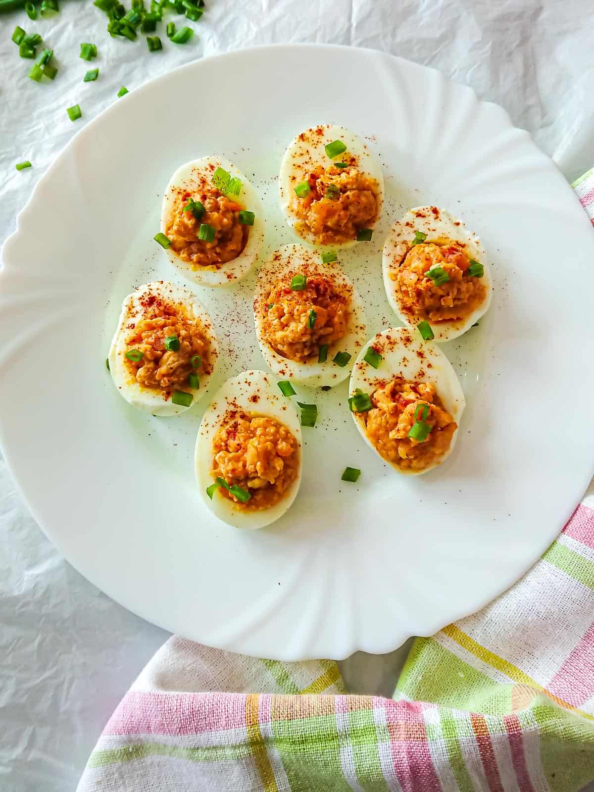 Keema chicken deviled eggs on a white ceramic plate.