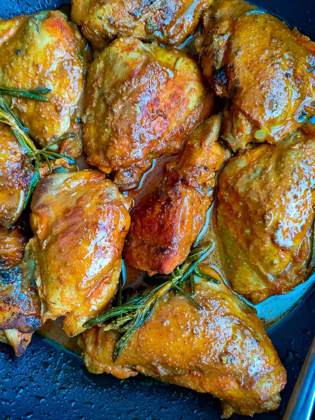 lemon balsamic chicken with rosemary sauce in a pan.