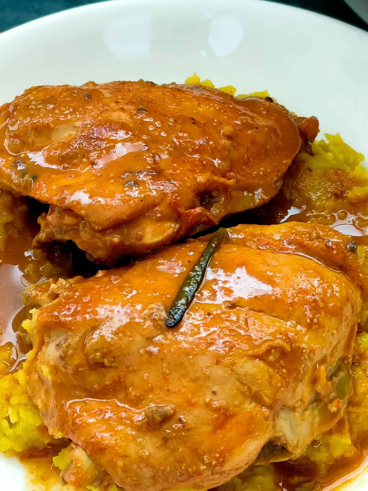 lemon balsamic chicken and sweet potato mash on a white plate.