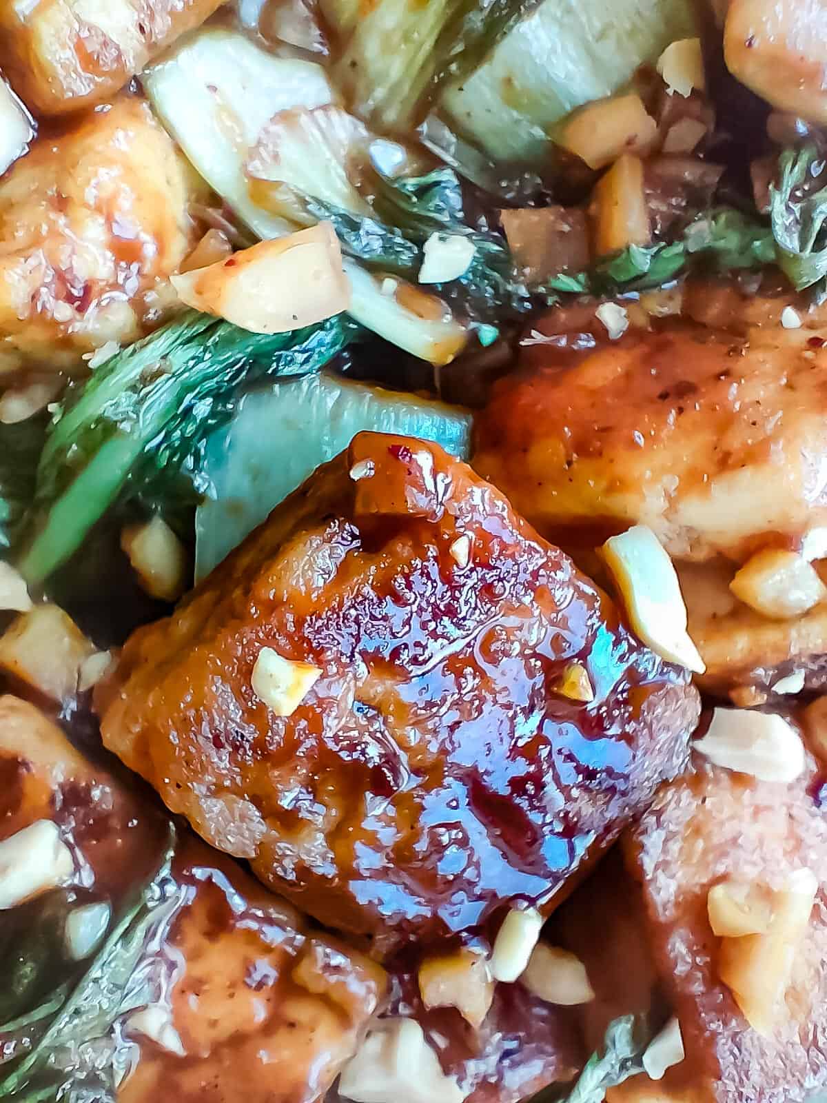 Close up view of bok choy and tofu stir fry.