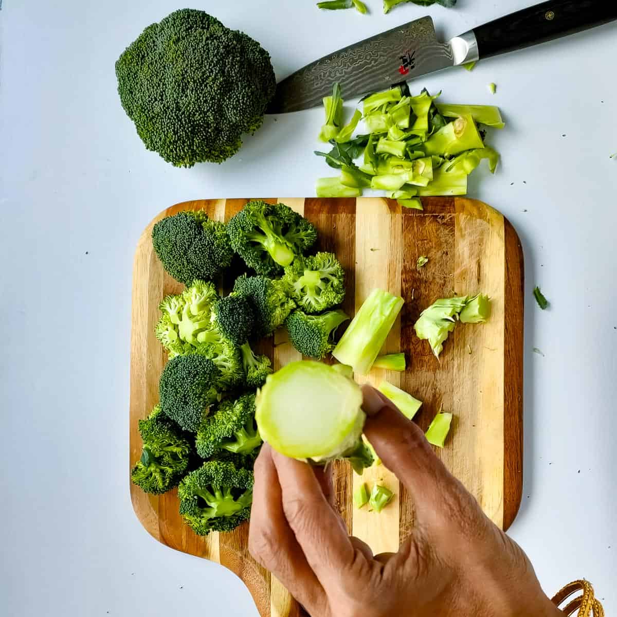 peeled broccoli stems and chopped florets for roasted potato and broccoli recipe.