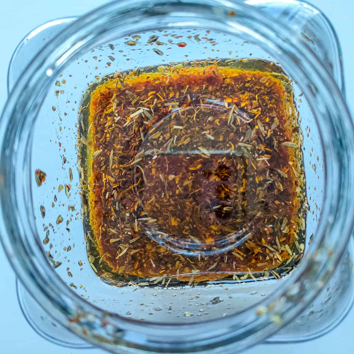 Quinoa Pasta Salad with Balsamic Vinaigrette whisked basil balsamic vinaigrette in a glass jar.