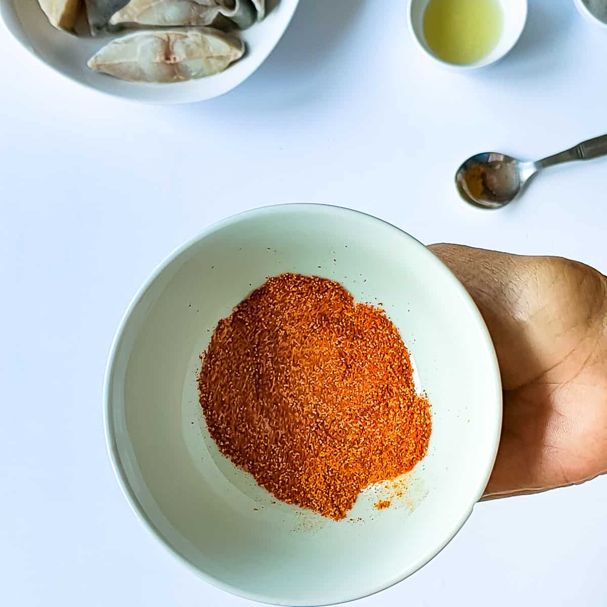 Mixed spices in a bowl for marinating the fish.