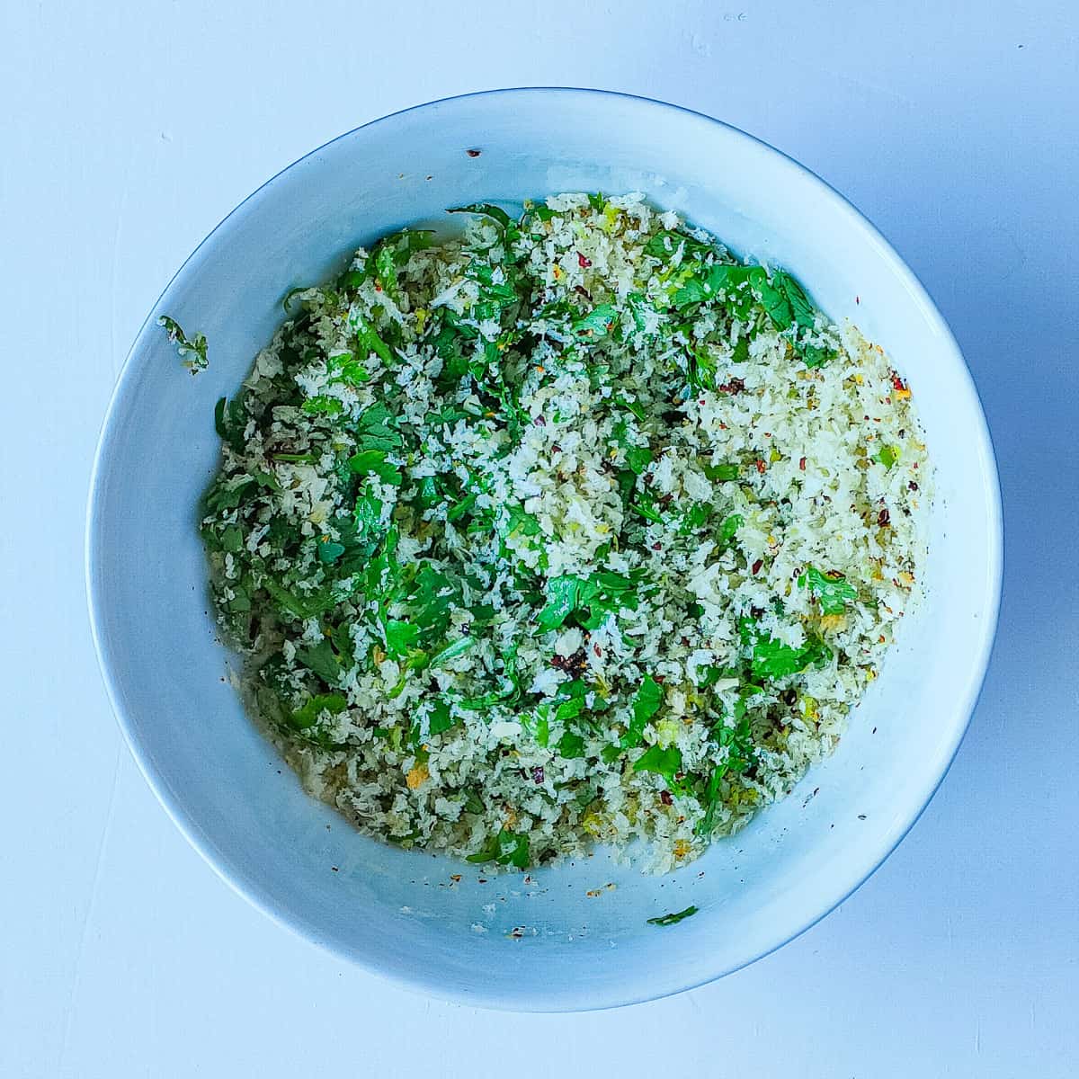 Seasoned Panko crust for panko pesto salmon in a white bowl.