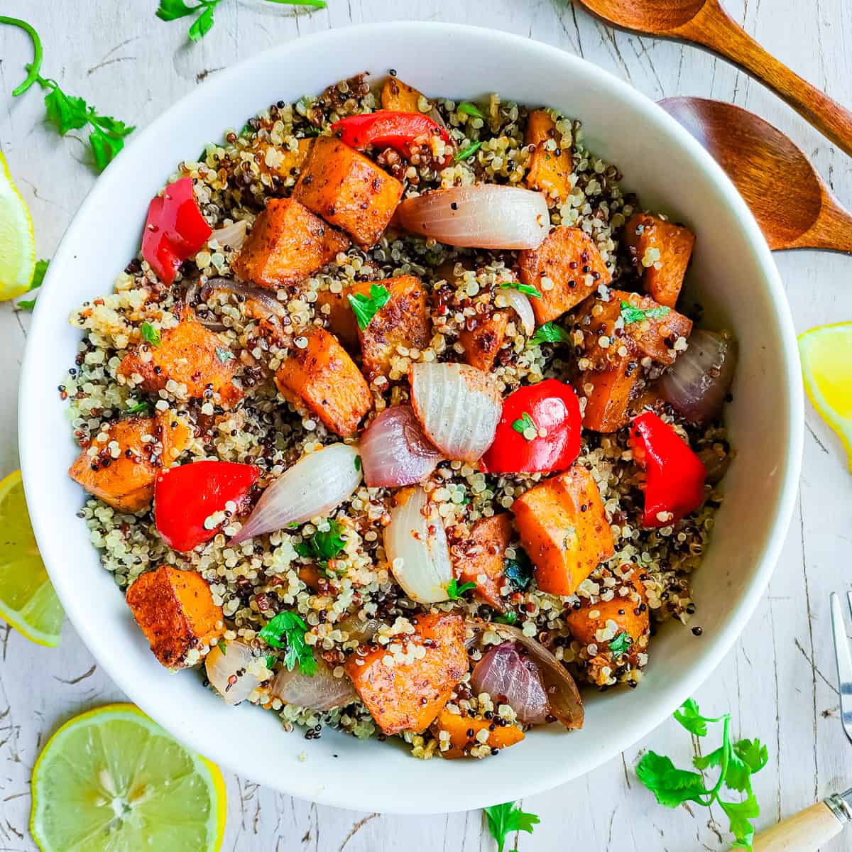 Roasted pumpkin salad with quinoa in a white bowl.