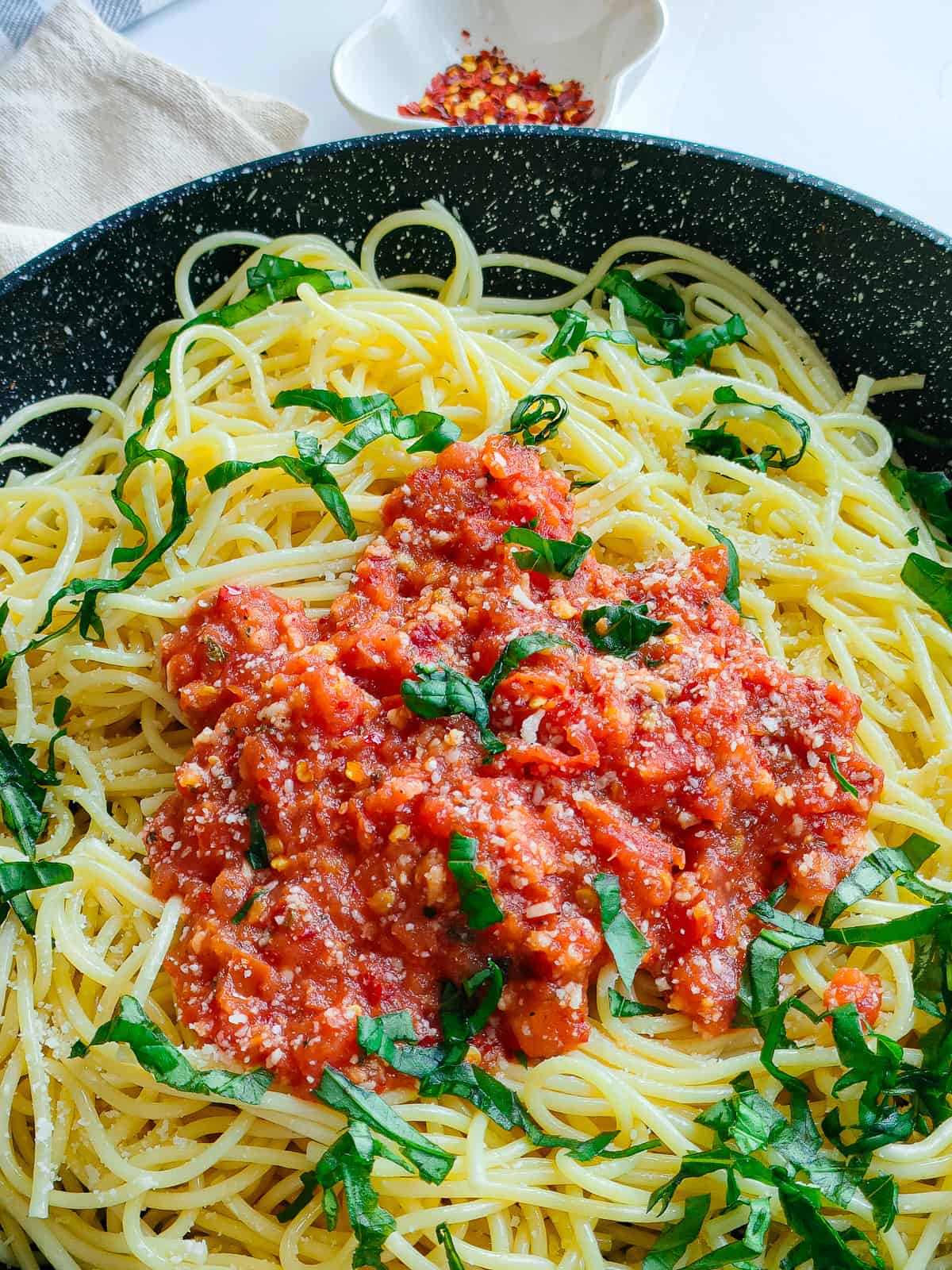 Spicy arrabiatta pasta in a non-stick pan.