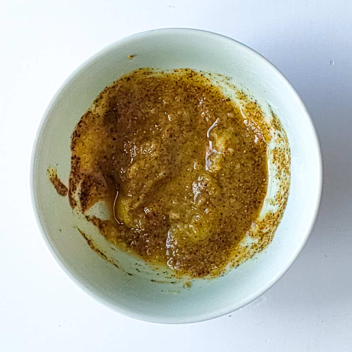 First marinade for tandoori pomfret in a white bowl.