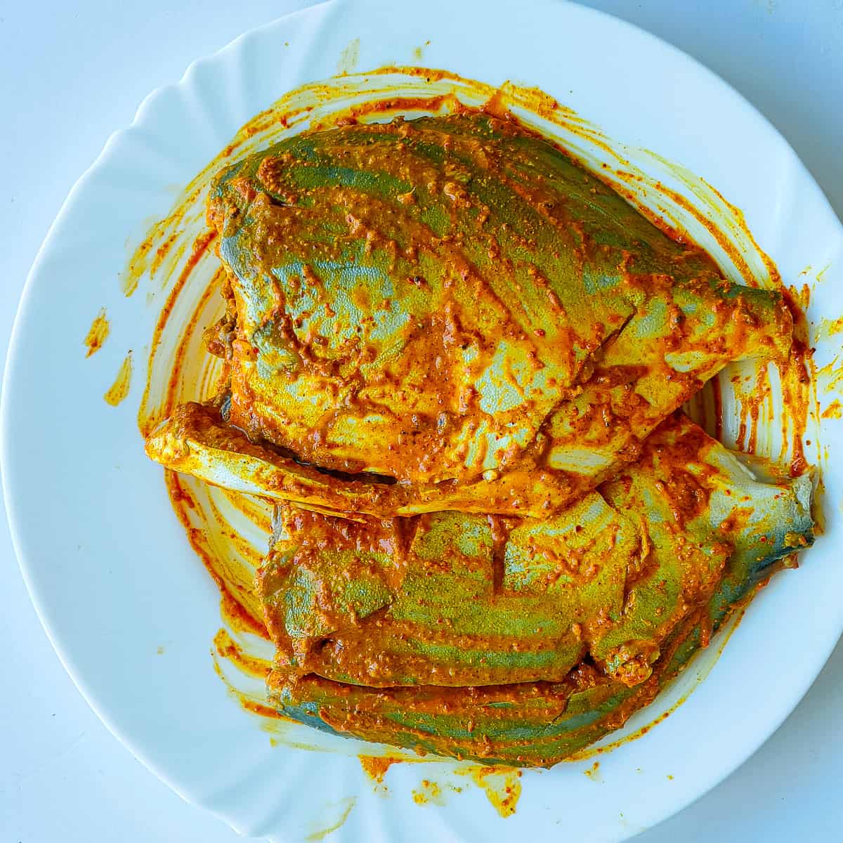 Pomfret marinated with tandoori spices and yogurt.