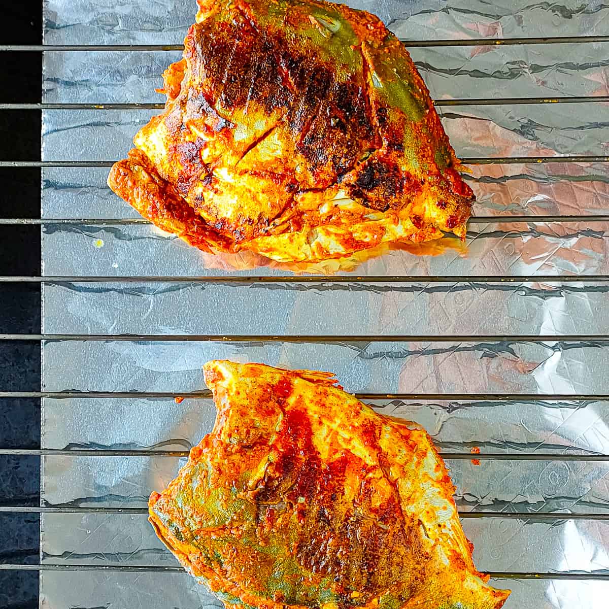 tandoori pomfret on an oven grill.