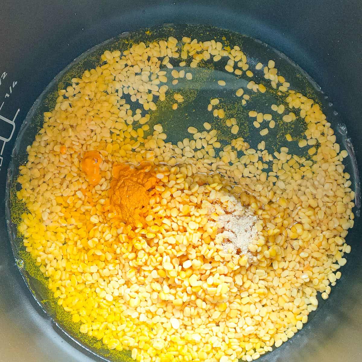 Dal with turmeric and asafoetida in an instant pot.
