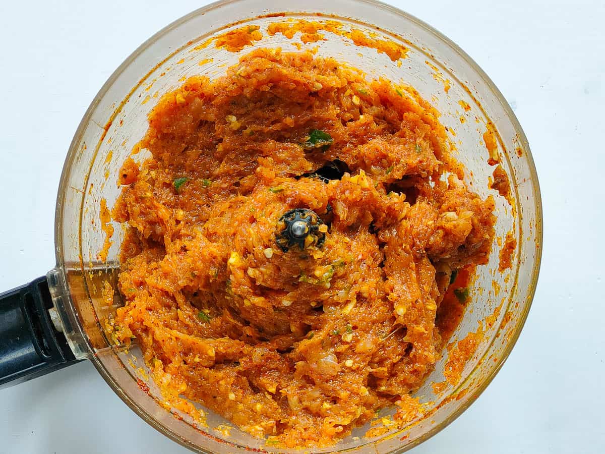 Minced chicken in a food processor jar.