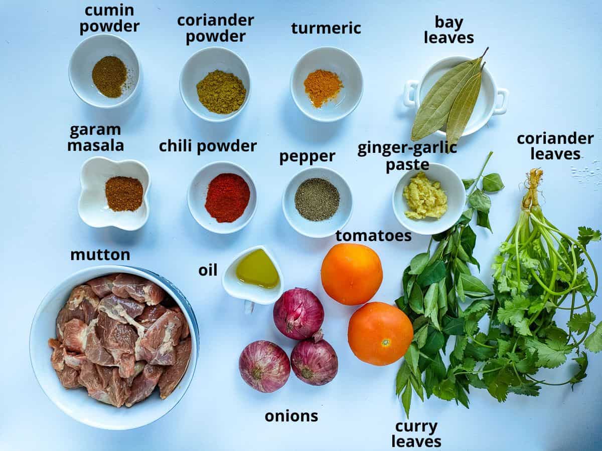 Labelled ingredients for goat masala recipe.