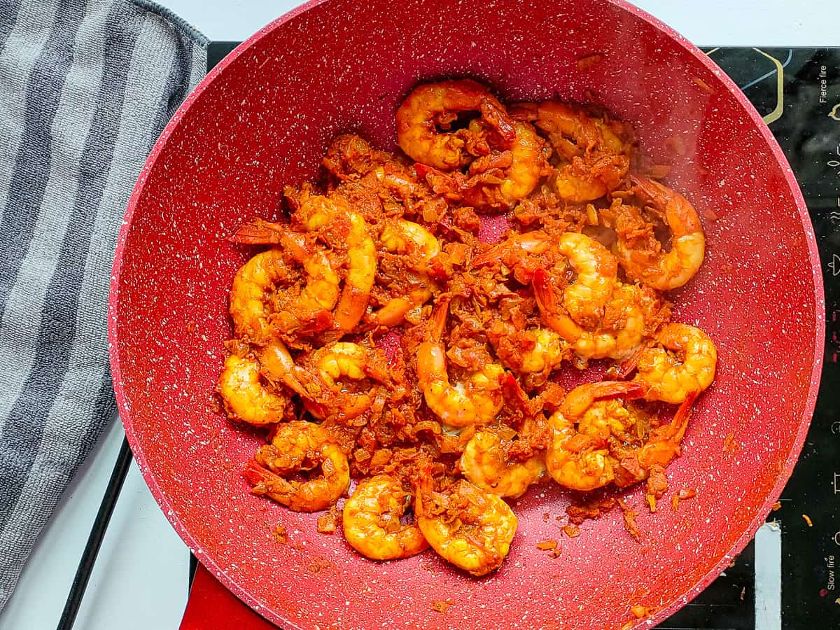 Cooked masala prawns in a non-stick pan.