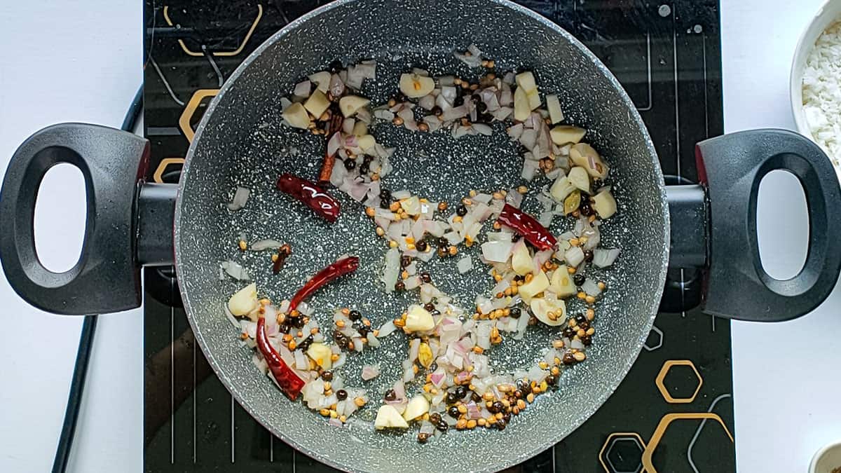 Roasted onions, garlic and spices in a non-stick cooking pot.