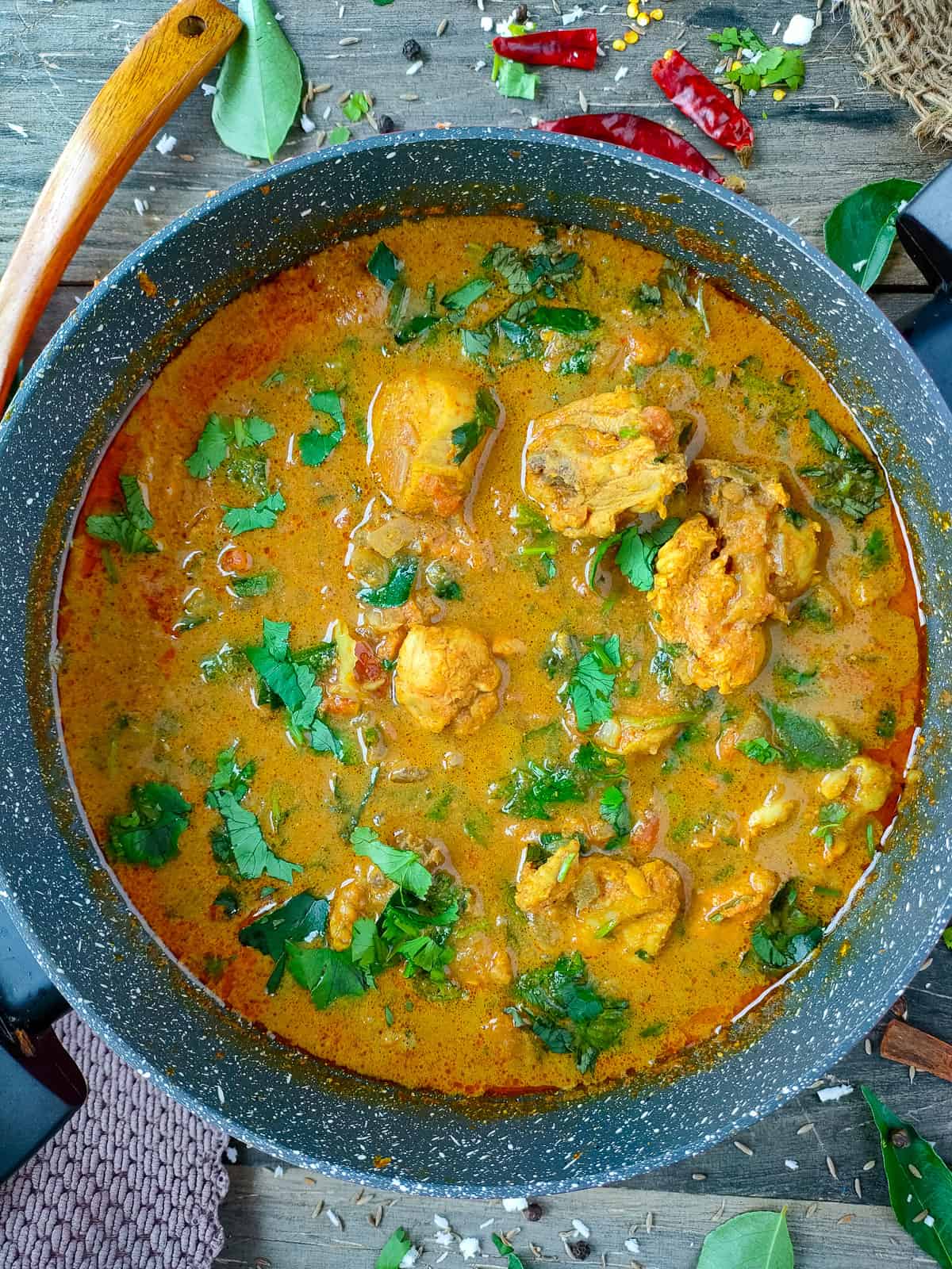 Authentic Indian chicken curry in a non-stick cooking pot.