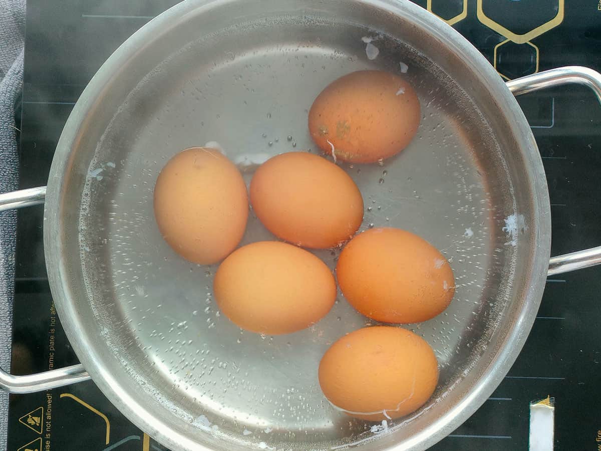 Boiled eggs in a pot.