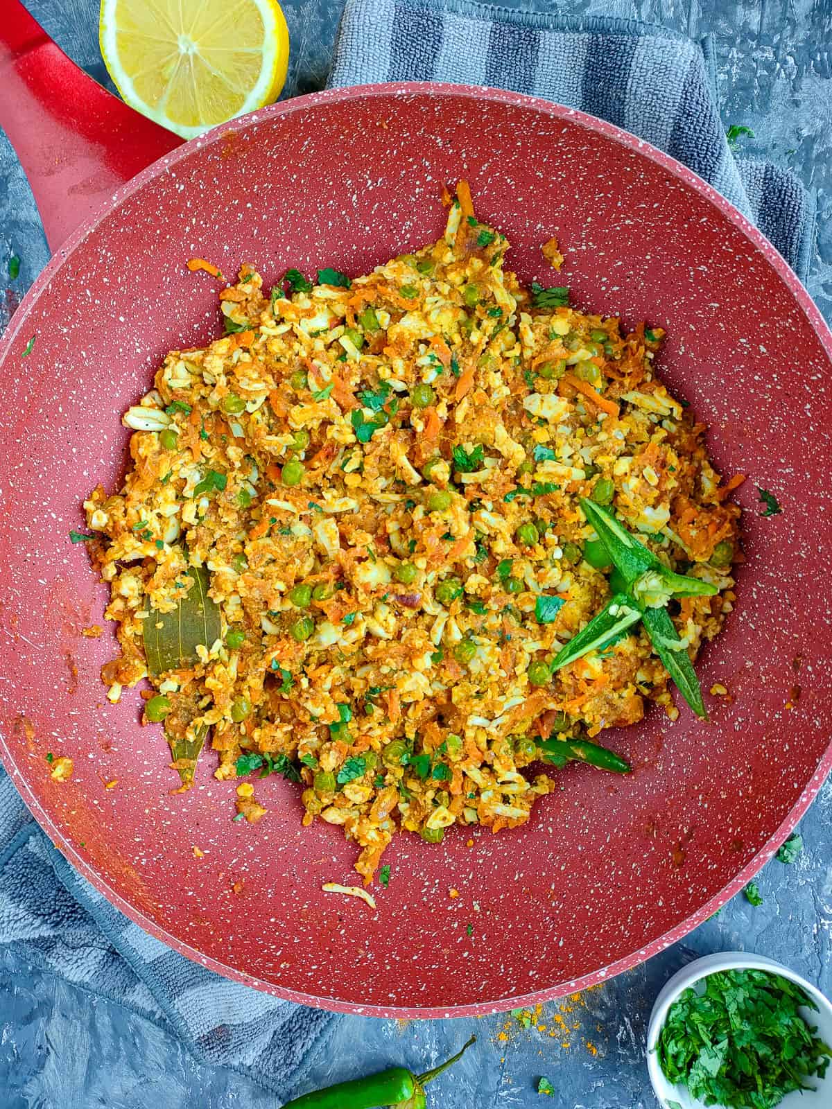 Anda keema masala in a non-stick wok.