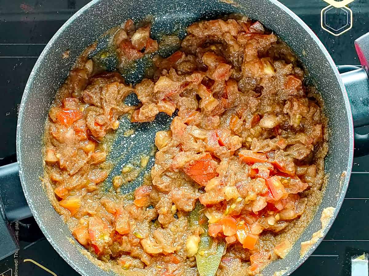 Onions and tomatoes cooked in a non stick pot.