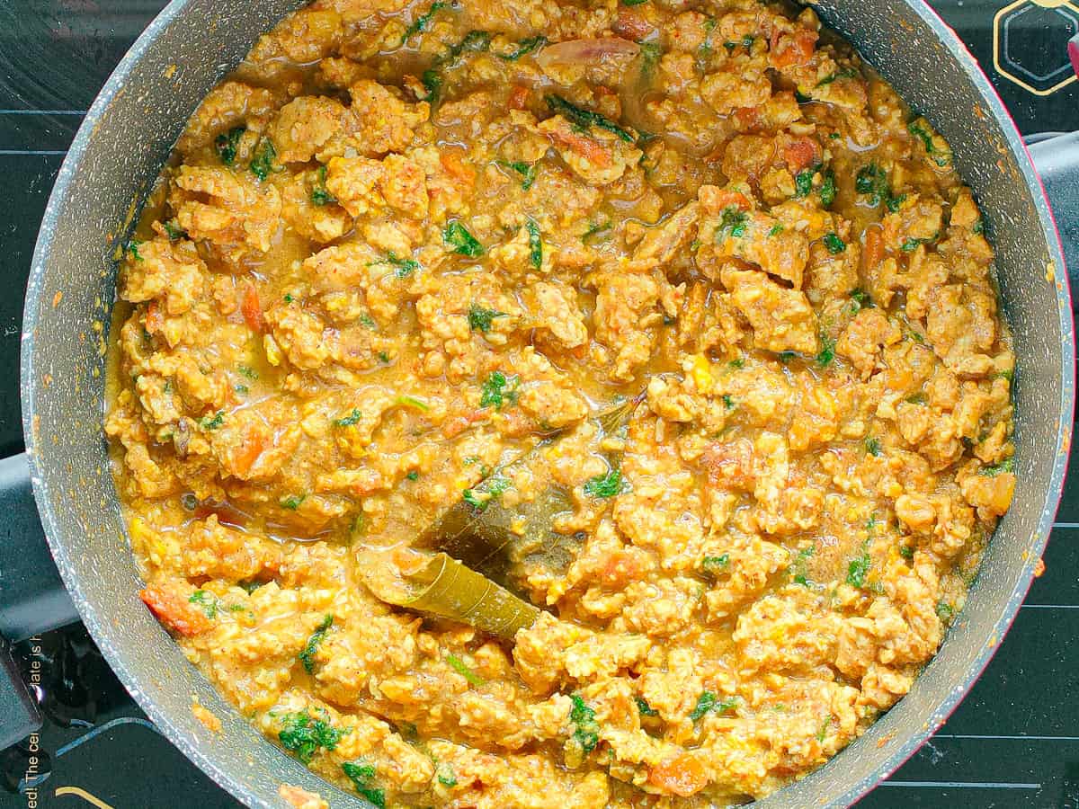 Chicken qeema curry in a non-stick pot.