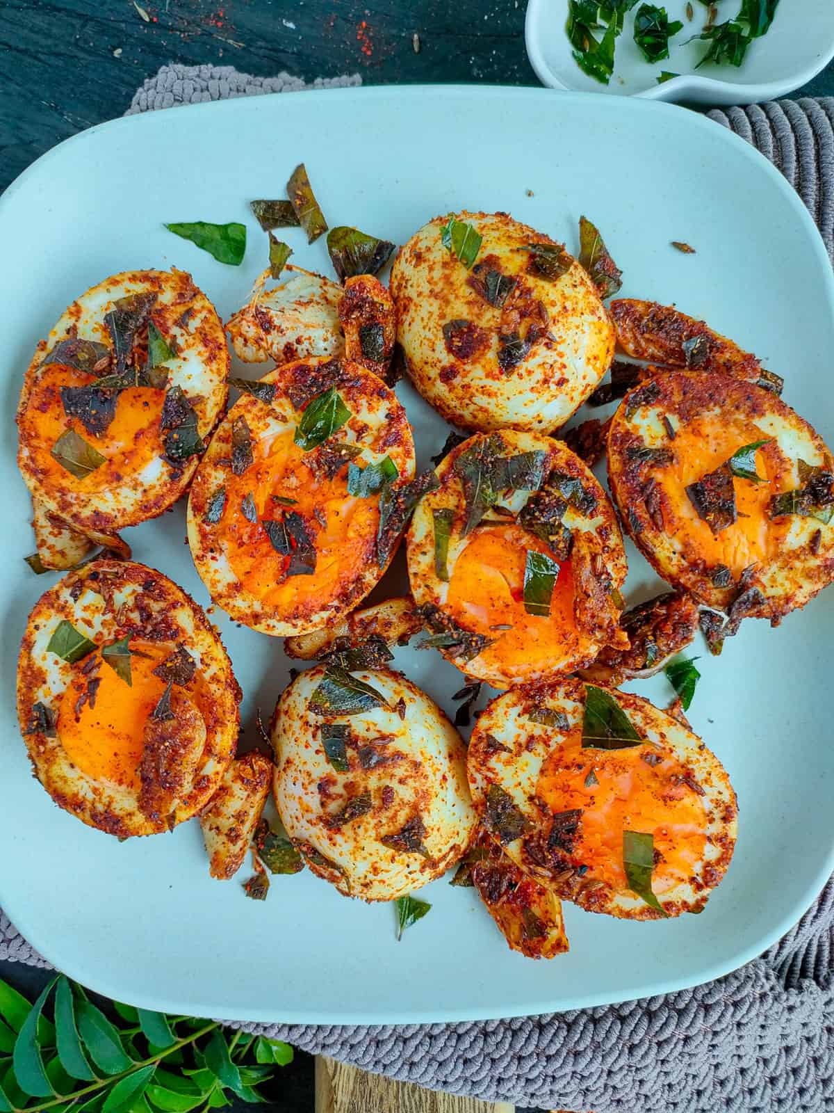 Pepper egg fry on an off-white plate.