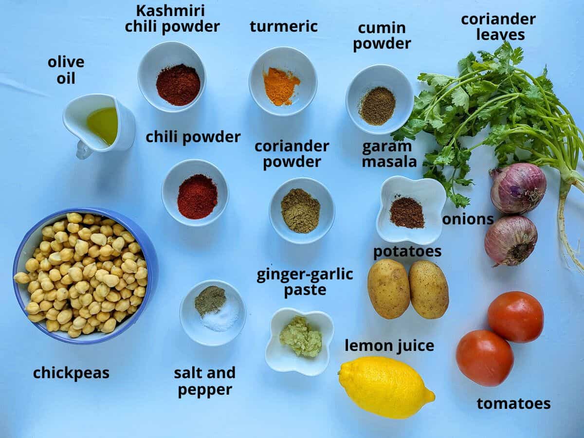 Labelled ingredients for Indian chickpea and potato curry.