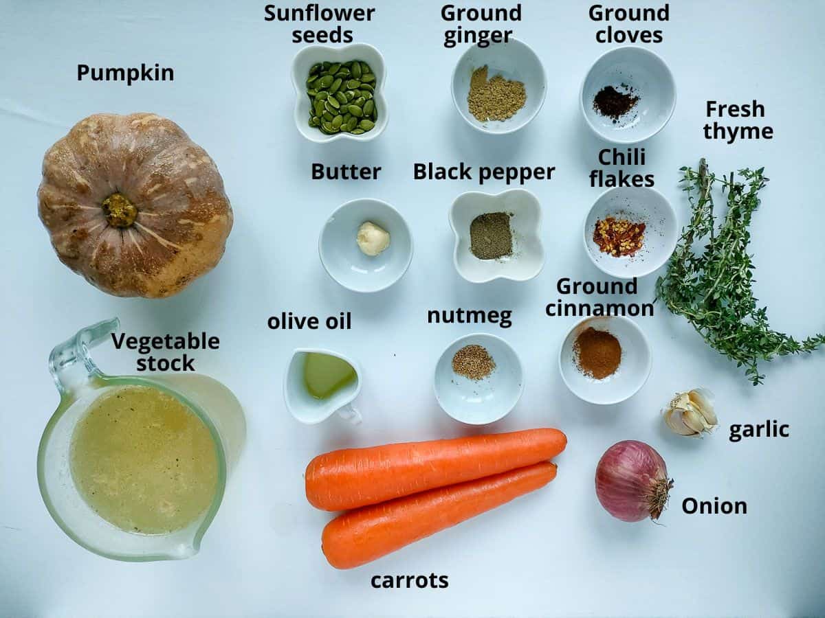 Labelled ingredients for pumpkin soup with carrots.