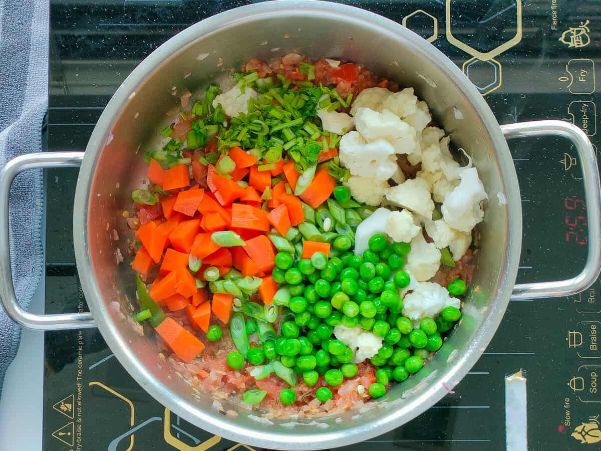 Mixed vegetables in a large pot.