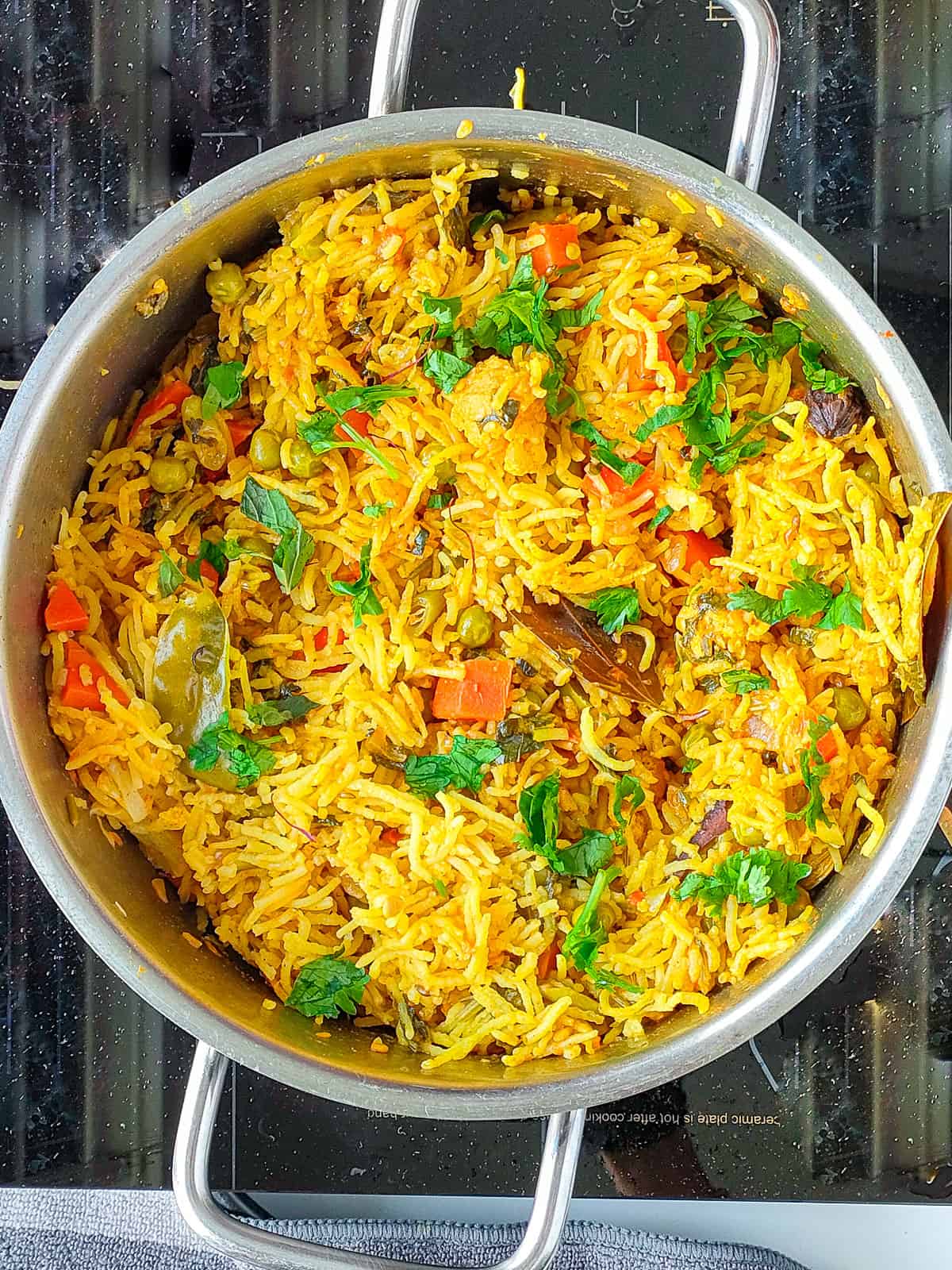 Biriyani pulao in a metal pot.