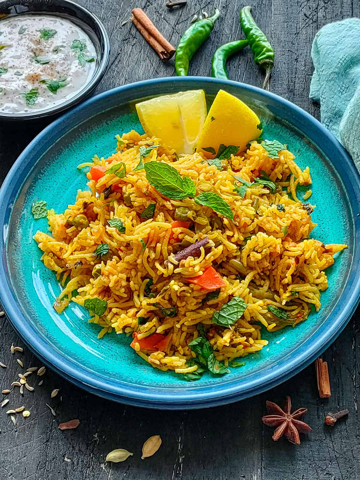 Veg biryani pulao on a blue plate.