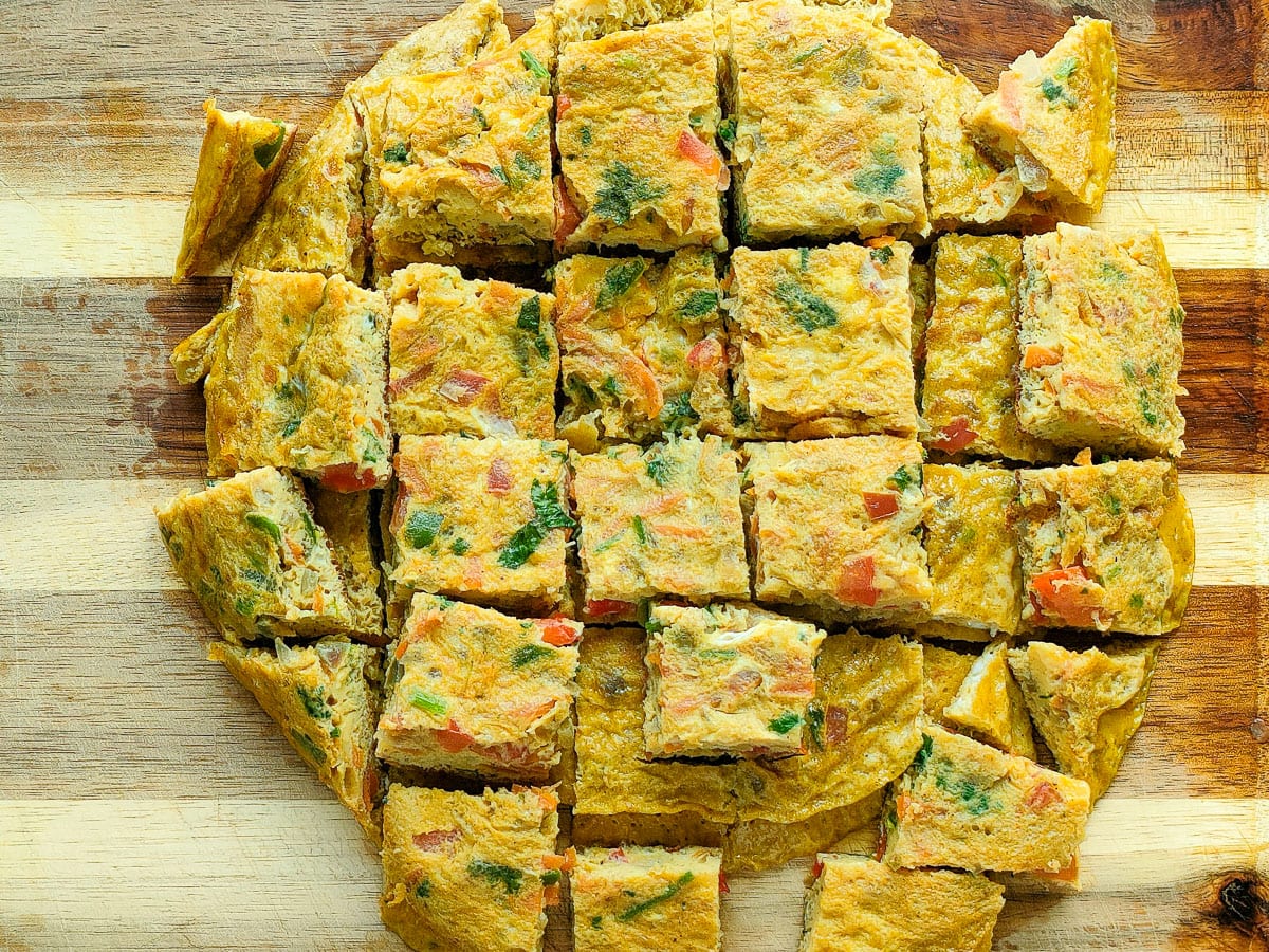 Omelet pieces on a chopping board.