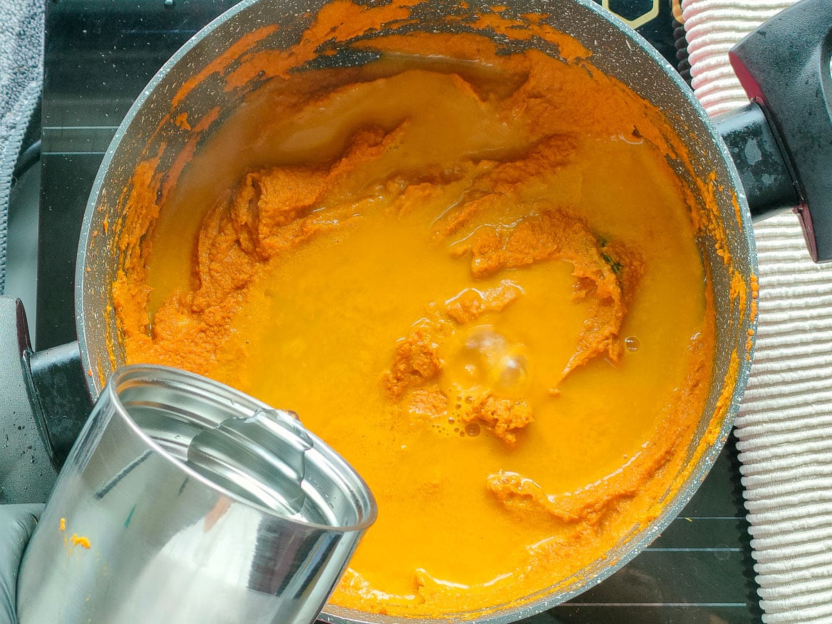 Water added to curry gravy in a pot.